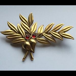 Brass botanical brooch with 2 red stones